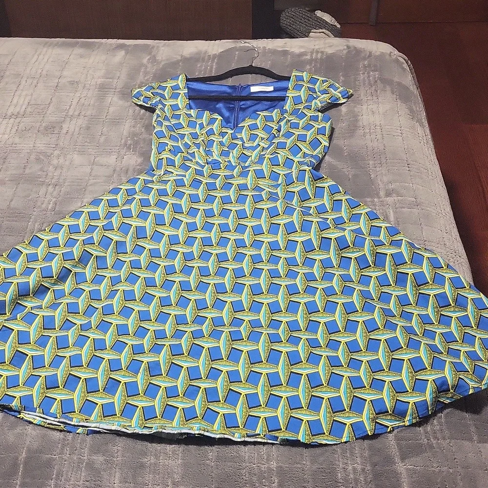 A patterned blue, turquoise, yellow & black dress. - Picture 3 of 5